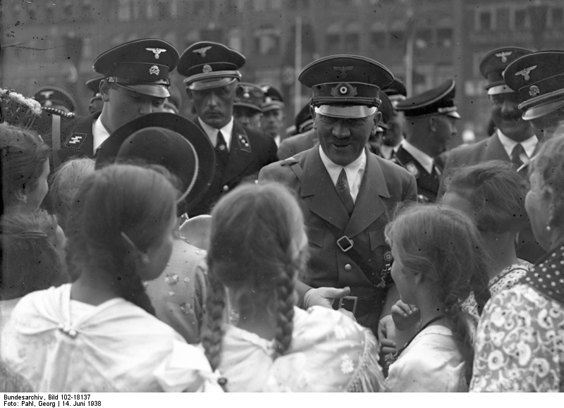 Adolf Hitler is greeted by a group of girls in Stettin